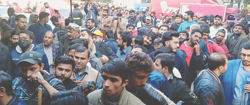 LAHORE: Fans queue up to purchase tickets for the upcoming Champions Trophy on Monday.—PPI